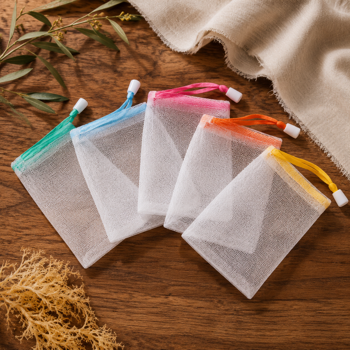 White nylon foaming soap bags with assorted colored drawstrings