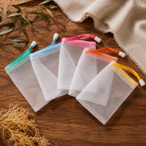 White nylon foaming soap bags with assorted colored drawstrings